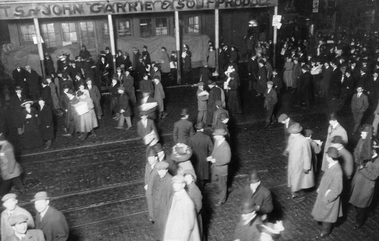 People stand in street waiting - Carpathia